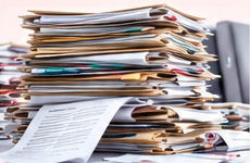 Before Summit - Stacked medical paper records